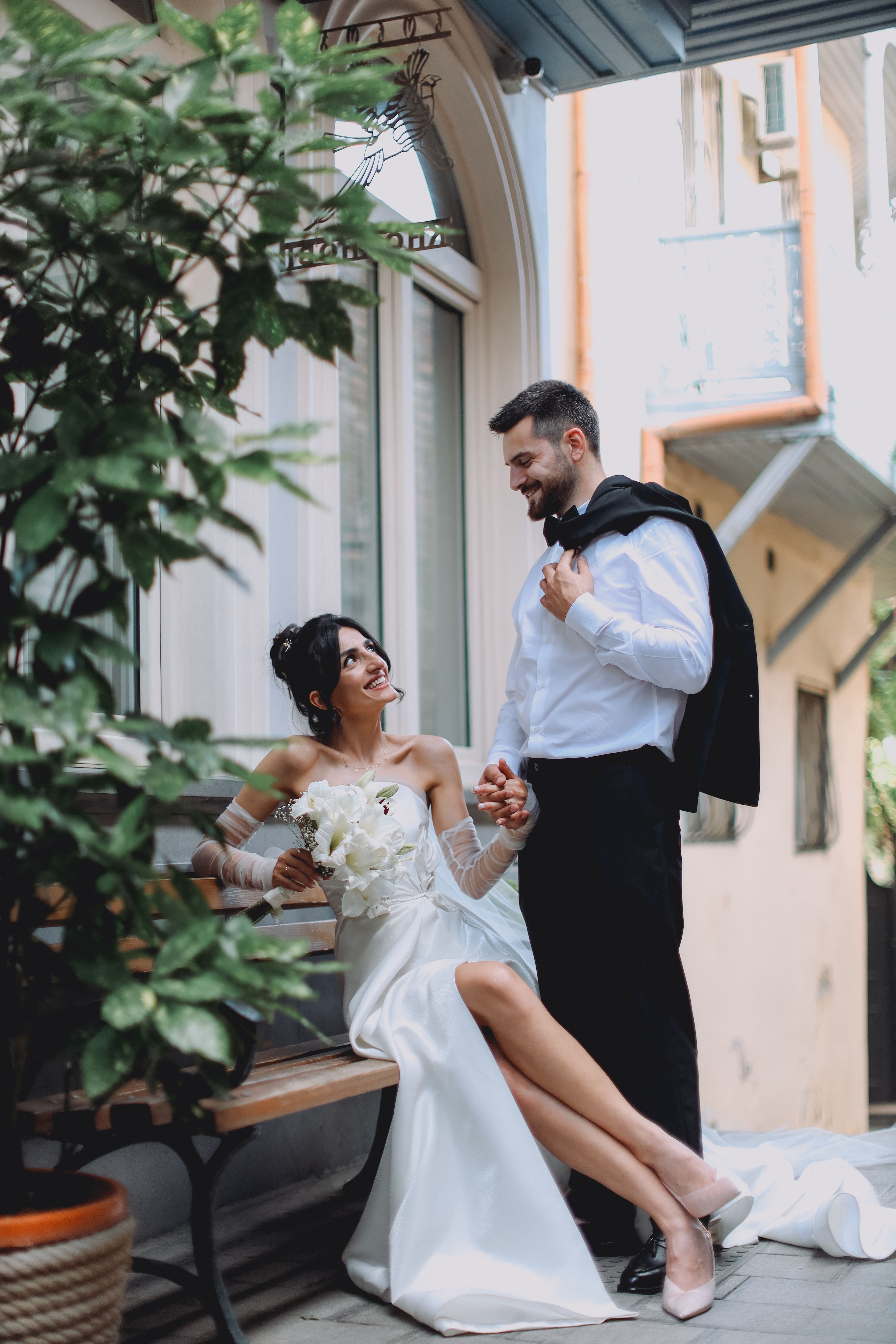 A newlywed couple in a candid embrace